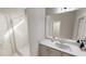Clean bathroom featuring a glass-enclosed shower, a modern vanity with a sink, and neutral decor at 339 Beacon Dr, Pittsboro, NC 27312