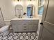 Bathroom featuring updated vanity, toilet, and patterned floor at 3669 W Greensboro Chapel Hill Rd, Liberty, NC 27298