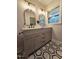 Bathroom vanity with double mirrors and updated hardware at 3669 W Greensboro Chapel Hill Rd, Liberty, NC 27298