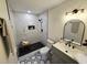 Modern bathroom featuring marble shower, patterned tile floor and a gray vanity at 3669 W Greensboro Chapel Hill Rd, Liberty, NC 27298