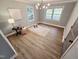 Cozy bedroom features wood floors, a modern light fixture and large windows at 3669 W Greensboro Chapel Hill Rd, Liberty, NC 27298