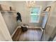 Chic closet with hardwood floors, built-in shelving, and a chandelier at 3669 W Greensboro Chapel Hill Rd, Liberty, NC 27298