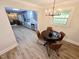 Dining area adjacent to the kitchen offers modern finishes and lots of natural light at 3669 W Greensboro Chapel Hill Rd, Liberty, NC 27298