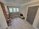 Inviting entryway with a brick accent wall, new tile floors, and lots of natural light at 3669 W Greensboro Chapel Hill Rd, Liberty, NC 27298