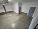 Spacious garage with concrete floor, brick accents, and door to interior at 3669 W Greensboro Chapel Hill Rd, Liberty, NC 27298