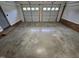 Garage interior with two overhead doors and a concrete floor at 3669 W Greensboro Chapel Hill Rd, Liberty, NC 27298