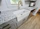 Modern kitchen featuring a farmhouse sink, granite countertops, and stainless steel appliances at 3669 W Greensboro Chapel Hill Rd, Liberty, NC 27298