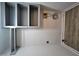 This laundry room features new vinyl floors, fresh paint, built-in cabinets, and utility hook-ups at 3669 W Greensboro Chapel Hill Rd, Liberty, NC 27298