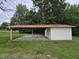 Exterior of an open-air shed in a spacious, grassy backyard at 3669 W Greensboro Chapel Hill Rd, Liberty, NC 27298