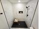 New marble shower with black hardware and built-in shelving at 3669 W Greensboro Chapel Hill Rd, Liberty, NC 27298