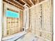 Unfinished bathroom area reveals stud walls, a window, and bench framing, ready for custom finishing touches and personalization at 3824 Coach Lantern Ave, Wake Forest, NC 27587