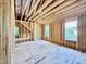 Spacious, unfinished room with exposed framing and three bright windows at 3824 Coach Lantern Ave, Wake Forest, NC 27587