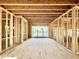 Exposed framework and unfinished interior features a sliding door, offering a blank canvas for personalization and design creativity at 3824 Coach Lantern Ave, Wake Forest, NC 27587