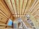 View looking up an unfinished staircase featuring exposed wooden studs and open frame awaiting final construction, showcasing customization options at 3824 Coach Lantern Ave, Wake Forest, NC 27587