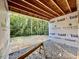 Unfinished back porch area overlooking a lush green backyard at 3828 Coach Lantern Ave, Wake Forest, NC 27587