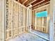 Framed bathroom featuring the new construction interior, showcasing the stud framing and window at 3828 Coach Lantern Ave, Wake Forest, NC 27587
