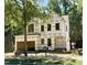 New construction home features black framed windows and unfinished exterior with yard sign at 3828 Coach Lantern Ave, Wake Forest, NC 27587