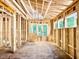 Framed living room with windows with views of the trees outside and sunlight at 3828 Coach Lantern Ave, Wake Forest, NC 27587