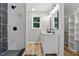 Contemporary bathroom featuring a walk-in shower with black and white tile and a double sink vanity at 3916 W Allen, Raleigh, NC 27603