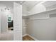 Walk-in closet with wooden shelving and storage, plus washer-dryer hook ups at 3916 W Allen, Raleigh, NC 27603