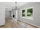 View of dining area with hardwood flooring, neutral paint, modern light fixture and lots of natural light at 3916 W Allen, Raleigh, NC 27603