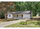 This single story home boasts a lovely yard, a covered front porch, and a fresh exterior paint job at 3916 W Allen, Raleigh, NC 27603