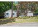 Charming single story home featuring a manicured front yard, inviting front porch, and lovely trees at 3916 W Allen, Raleigh, NC 27603