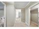 Inviting hallway featuring neutral paint, carpeted flooring, closet, and view into the kitchen at 3916 W Allen, Raleigh, NC 27603