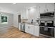 Kitchen features stainless steel appliances, and an abundance of white cabinetry at 3916 W Allen, Raleigh, NC 27603
