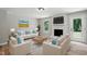 Bright living room with hardwood flooring, fireplace, neutral decor, and plenty of natural light at 3916 W Allen, Raleigh, NC 27603