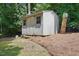 Backyard storage shed with double doors, providing ample storage space at 3916 W Allen, Raleigh, NC 27603