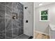 Stunning tiled shower featuring black hardware and a mosaic floor at 3916 W Allen, Raleigh, NC 27603