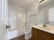 Clean bathroom with a shower, tub, vanity, and toilet at 4025 Scofield Dr, Raleigh, NC 27610