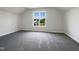 Spacious bedroom with light coming through the window and neutral-toned carpet at 4025 Scofield Dr, Raleigh, NC 27610