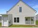 Well-maintained home exterior with white siding and green lawn at 4025 Scofield Dr, Raleigh, NC 27610