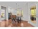 Cozy breakfast nook featuring a wooden table, seating, and natural light streaming through the window at 4036 Mackenzie Dr, Haw River, NC 27258