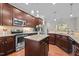 Modern kitchen with stainless steel appliances, granite countertops, and ample cabinet space at 4036 Mackenzie Dr, Haw River, NC 27258