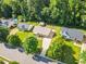 An aerial view of a home in a verdant neighborhood featuring mature trees and well-maintained lawns at 404 Southerby Dr, Garner, NC 27529