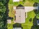 Aerial view of home with a large, grassy backyard, shed, patio, and wooden deck at 404 Southerby Dr, Garner, NC 27529