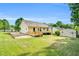 Large backyard featuring a wooden deck, patio, shed, and mature trees at 404 Southerby Dr, Garner, NC 27529