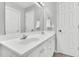 Well-lit bathroom offers a large mirror, double sinks, white cabinetry, and great storage at 404 Southerby Dr, Garner, NC 27529