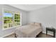 Bright bedroom featuring natural light from the large window and wood floors at 404 Southerby Dr, Garner, NC 27529