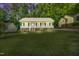 Charming home featuring a welcoming porch and lush green lawn at 404 Southerby Dr, Garner, NC 27529