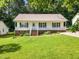 Inviting single-story home with a covered porch and well-maintained front yard at 404 Southerby Dr, Garner, NC 27529