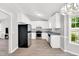 Modern kitchen with white cabinets, stainless steel appliances, and gray countertops at 404 Southerby Dr, Garner, NC 27529