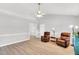 Cozy living room featuring hardwood floors, neutral colors, and comfortable seating at 404 Southerby Dr, Garner, NC 27529