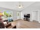 Bright living room with a high ceiling, wood floors, and ample natural light at 404 Southerby Dr, Garner, NC 27529