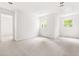Spacious bedroom with a walk in closet and two windows at 406 Johns Woods Rd, Chapel Hill, NC 27516
