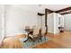 Bright dining area features hardwood floors and natural wood beams at 406 Johns Woods Rd, Chapel Hill, NC 27516