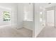 Bright hallway with a large closet and neutral carpet at 406 Johns Woods Rd, Chapel Hill, NC 27516